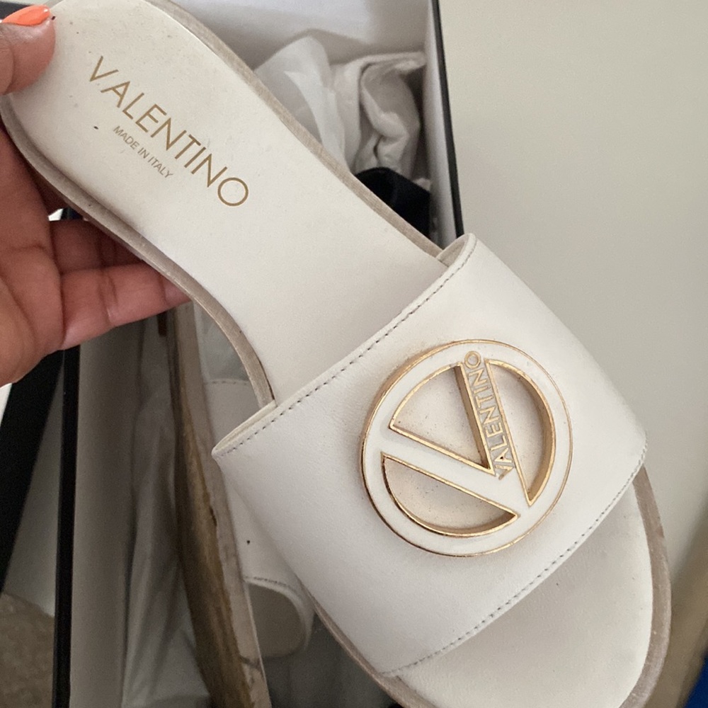 Worn once valentino slides they are white with a little bit of gold on it size7